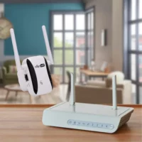 Image of a router on a table and the Magni WiFi next to it